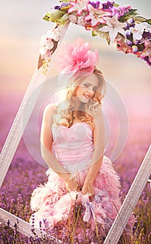 Beautiful blonde girl in a field of lavender
