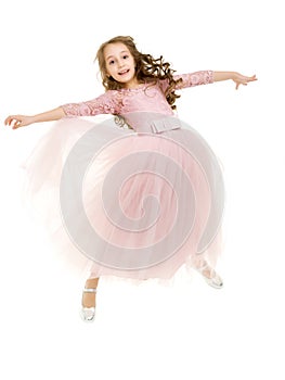 Beautiful Blonde Girl Happily Jumping with Raising Hands