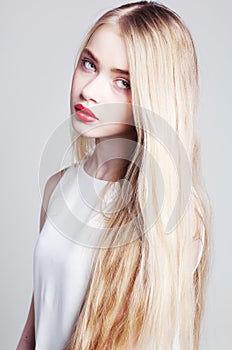 Beautiful blonde girl with long hair and green eyes
