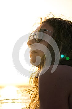 Beautiful blonde girl with sunglasses and hair