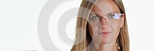 Beautiful blonde middle aged woman wearing glasses for better vision