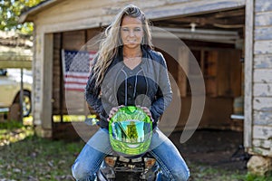 Beautiful Blonde Model Posing With A Street Motorcycle On A Sunny Day