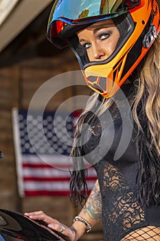 Beautiful Blonde Model Posing With A Street Motorcycle On A Sunny Day