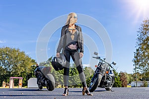 Beautiful Blonde Model Posing With A Street Motorcycle On A Sunny Day