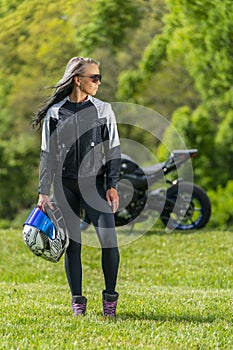 Beautiful Blonde Model Posing With A Street Motorcycle On A Sunny Day