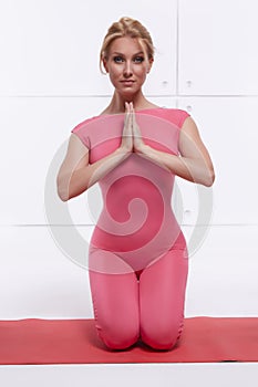 Beautiful blonde perfect athletic slim figure engaged in yoga, exercise or fitness, lead a healthy lifestyle, and eats r