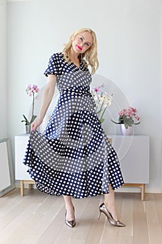 Beautiful blonde in polka dot dress