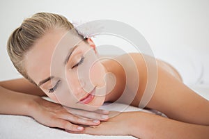 Beautiful blonde relaxing on massage table