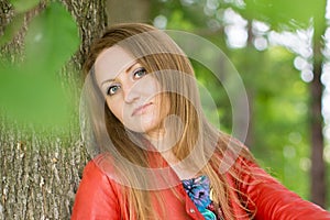 Beautiful blonde in summer park