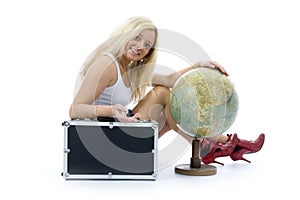 Beautiful blonde with valise and globe