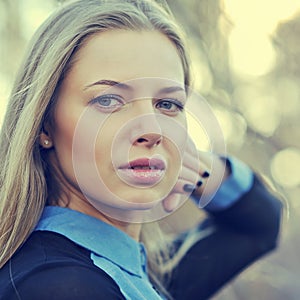 Beautiful blonde woman face. Close up portrait of a fashion female model