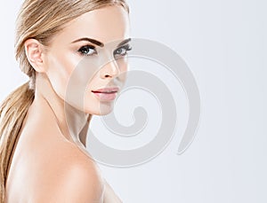 Beautiful blonde woman face close up portrait studio on white