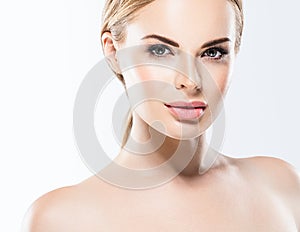 Beautiful blonde woman face close up portrait studio on white