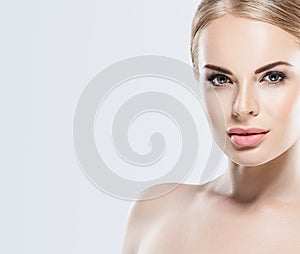 Beautiful blonde woman face close up portrait studio on white