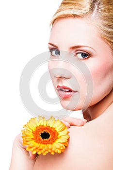 Beautiful blonde woman with a flower