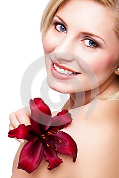 Beautiful blonde woman with a flower