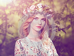 Beautiful blonde woman with flower wreath on her head