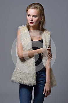 Beautiful blonde woman in fur jacket.
