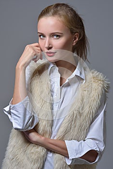Beautiful blonde woman in fur jacket