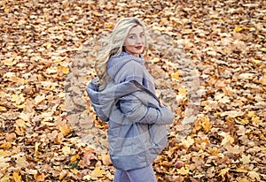 beautiful blonde woman in puffer coat. autumn fashion and beauty. pretty girl has long curly blond hair. lady in fall