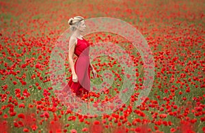 Beautiful blonde woman in red poppy field