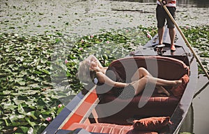 Beautiful blonde woman riding on Gondola. Travels concept