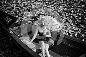 Beautiful blonde woman riding on Gondola. Travels concept