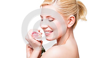 Beautiful blonde woman with a rose