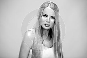 Beautiful blonde woman with shiny long straight hair and natural fresh make up. Fashion beauty portrait