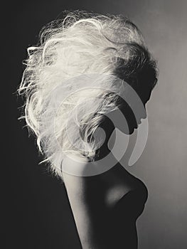 Beautiful blonde woman with volume hairstyle