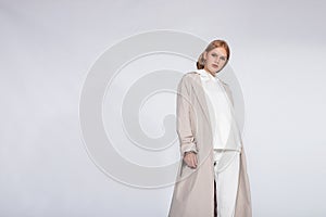 Beautiful blonde woman wear of white set of tracksuit isolated