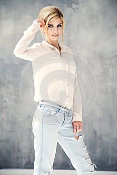 Beautiful blonde young woman in casual style. Fashion model