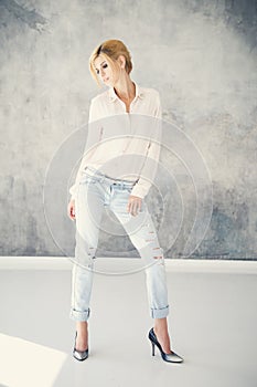 Beautiful blonde young woman in casual style. Fashion model