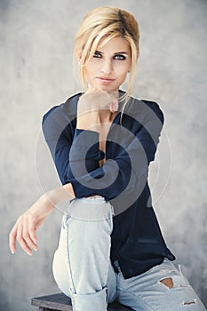 Beautiful blonde young woman in casual style. Fashion model