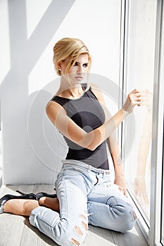 Beautiful blonde young woman in casual style. Fashion model