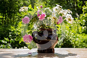 Beautiful blooming flowers in a vase in the gardern