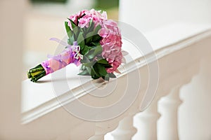Beautiful blossoming pink hydrangea and orchids in weddin bouquet