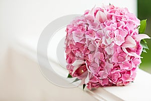 Beautiful blossoming pink hydrangea and orchids in weddin bouquet