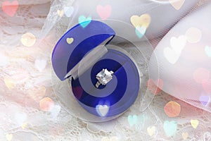 Beautiful blue box with wedding ring.White shoes. wedding shoes. Bride`s high heels. The fees of the bride. Wedding jewelry.