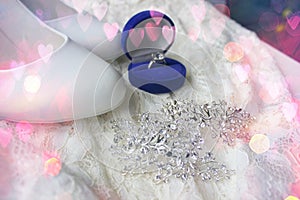 Beautiful blue box with wedding ring.White shoes. wedding shoes. Bride`s high heels. The fees of the bride. Wedding jewelry.