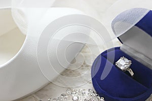 Beautiful blue box with wedding ring.White shoes. wedding shoes. Bride`s high heels. The fees of the bride. Wedding jewelry.