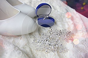 Beautiful blue box with wedding ring.White shoes. wedding shoes. Bride`s high heels. The fees of the bride. Wedding jewelry.