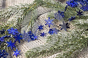 Beautiful blue Christmas garland with patterns in on a cozy light textured background, close up