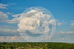 Beautiful blue clouds of unusual shape at the horizon level