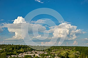 Beautiful blue clouds of unusual shape at the horizon level