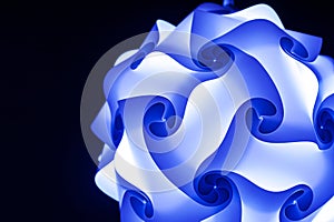 Beautiful blue design lamp on black background