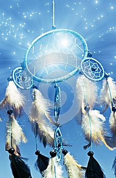 Beautiful blue dreamcatcher with feathers and stars