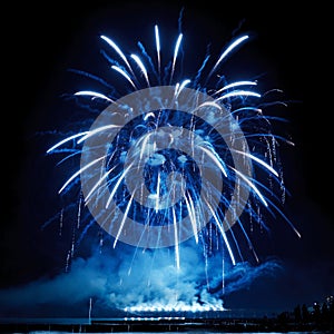 Beautiful blue fireworks on the black sky background.