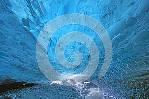 Beautiful blue ice cave inside the Glacier