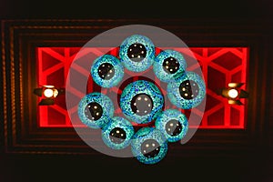 Beautiful blue lamp in Oriental style hanging on the ceiling